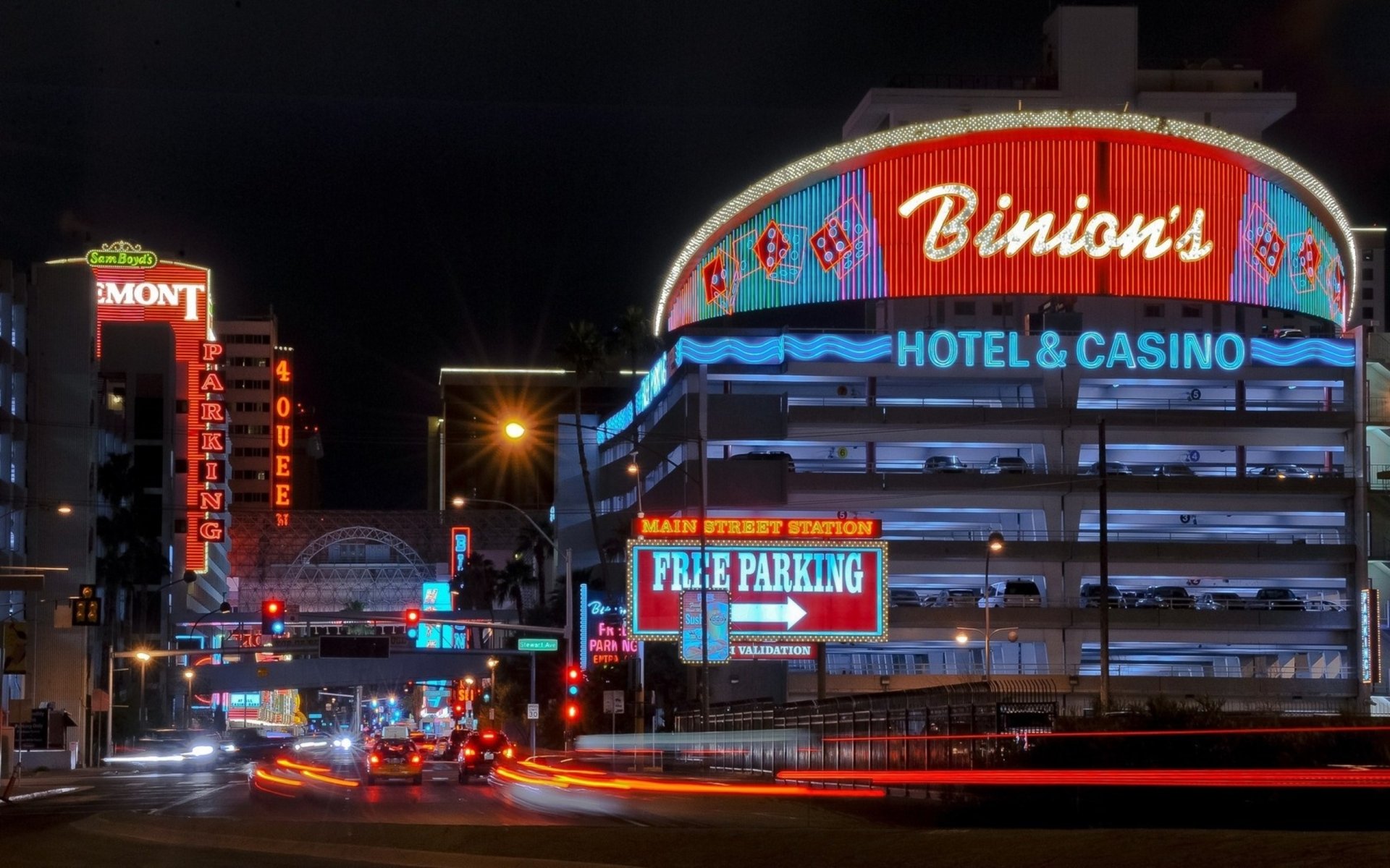HD desktop wallpaper showing a vibrant nighttime view of man-made Las Vegas, featuring Binion's Hotel & Casino illuminated with neon lights.