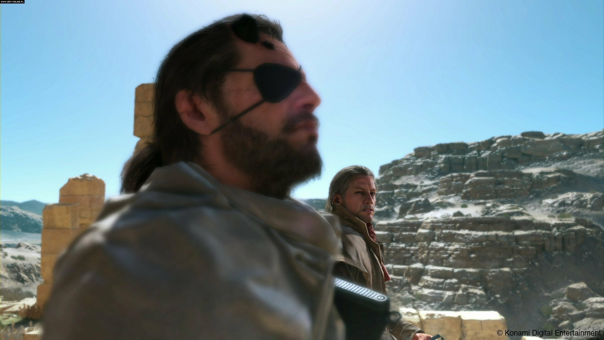 HD PC desktop wallpaper featuring characters from the video game Metal Gear Solid V: The Phantom Pain against a rugged, rocky outdoor background.