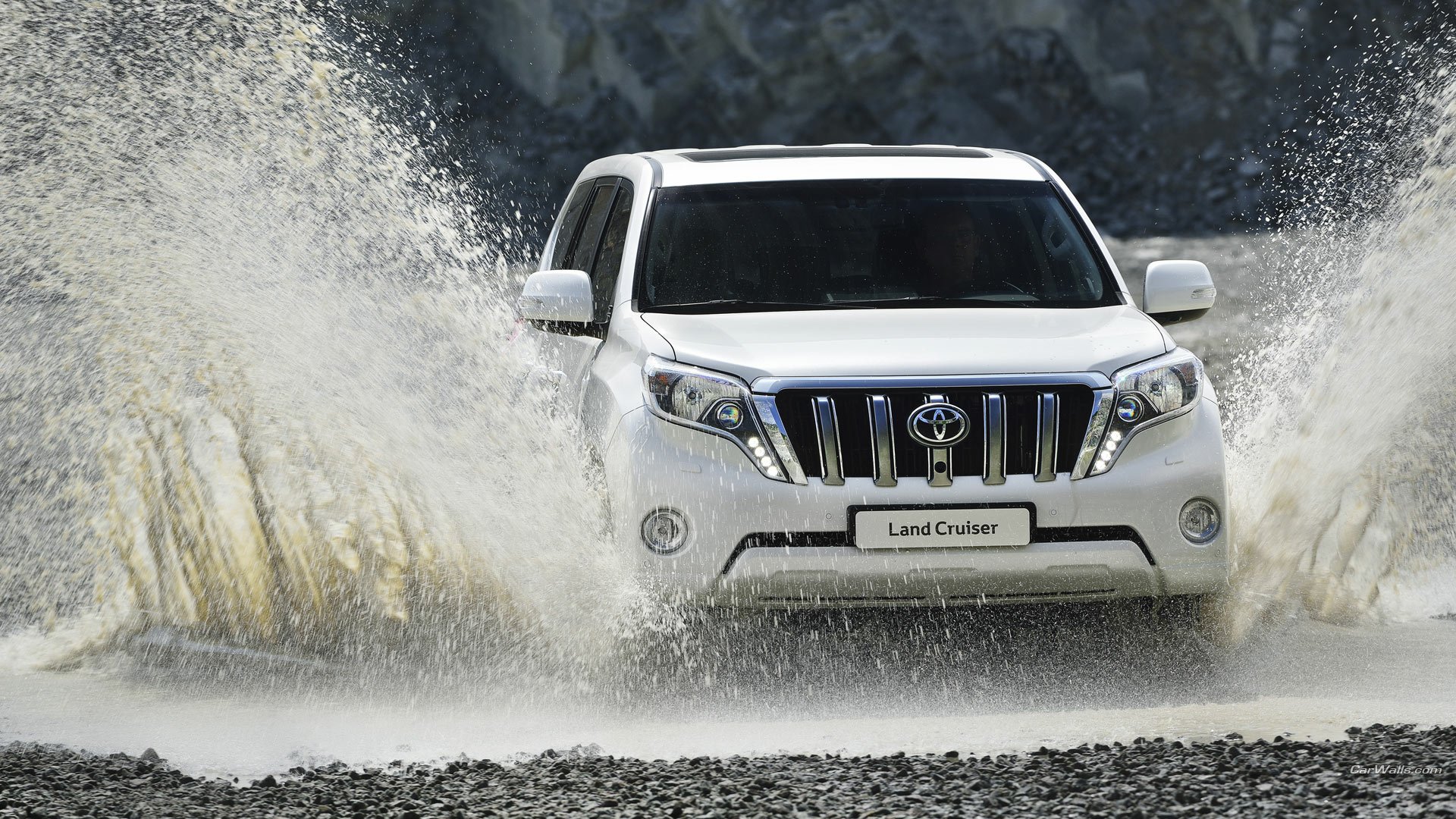 White 2014 Toyota Land Cruiser driving through water splashes, captured in high definition as a PC desktop wallpaper and background.