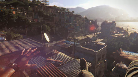 Dying Light video game HD PC desktop wallpaper: first-person rooftop view over a sunlit coastal favela, hands reaching over corrugated roofs toward the water.