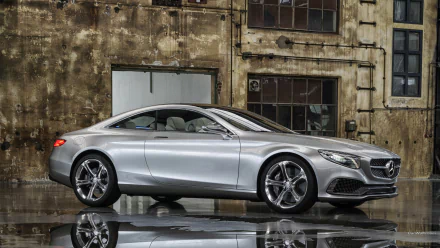 HD PC desktop wallpaper featuring a sleek silver Mercedes-Benz S-Class Coupe parked in front of an industrial-style building.