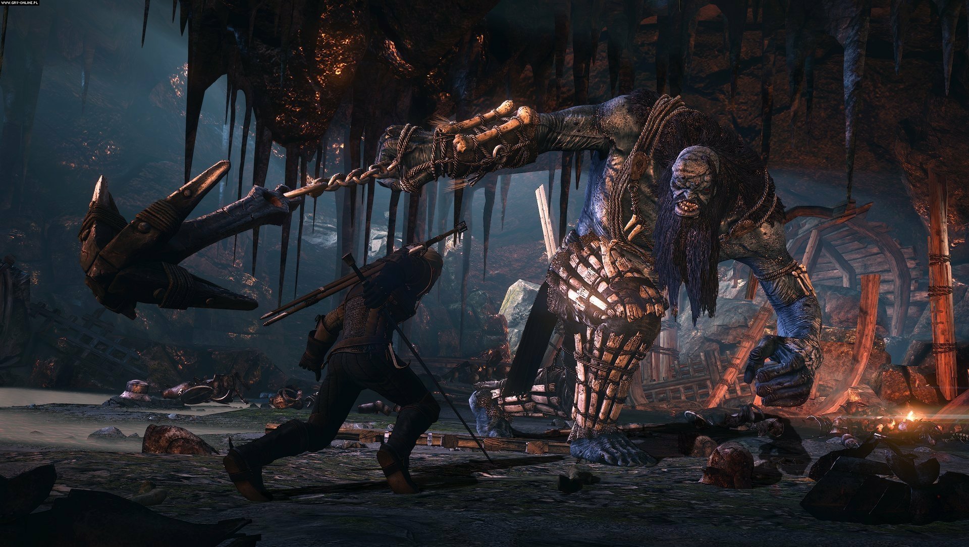 A dramatic scene from The Witcher 3: Wild Hunt, featuring a character confronting a massive enemy in a dark, eerie environment, showcasing the game's stunning HD graphics.