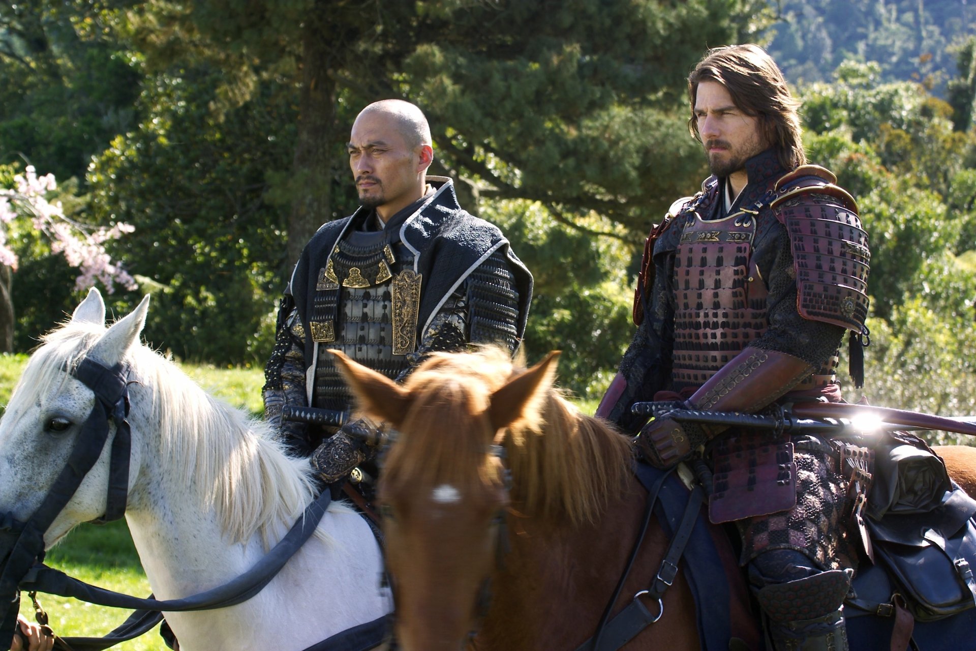 Two samurai warriors in traditional armor atop horses, set against a lush landscape, captured in a scene from the movie The Last Samurai. HD desktop wallpaper quality.