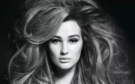 Black and white HD desktop wallpaper featuring a close-up portrait of a woman with voluminous hair, tagged Anna Wasacz-Carter.