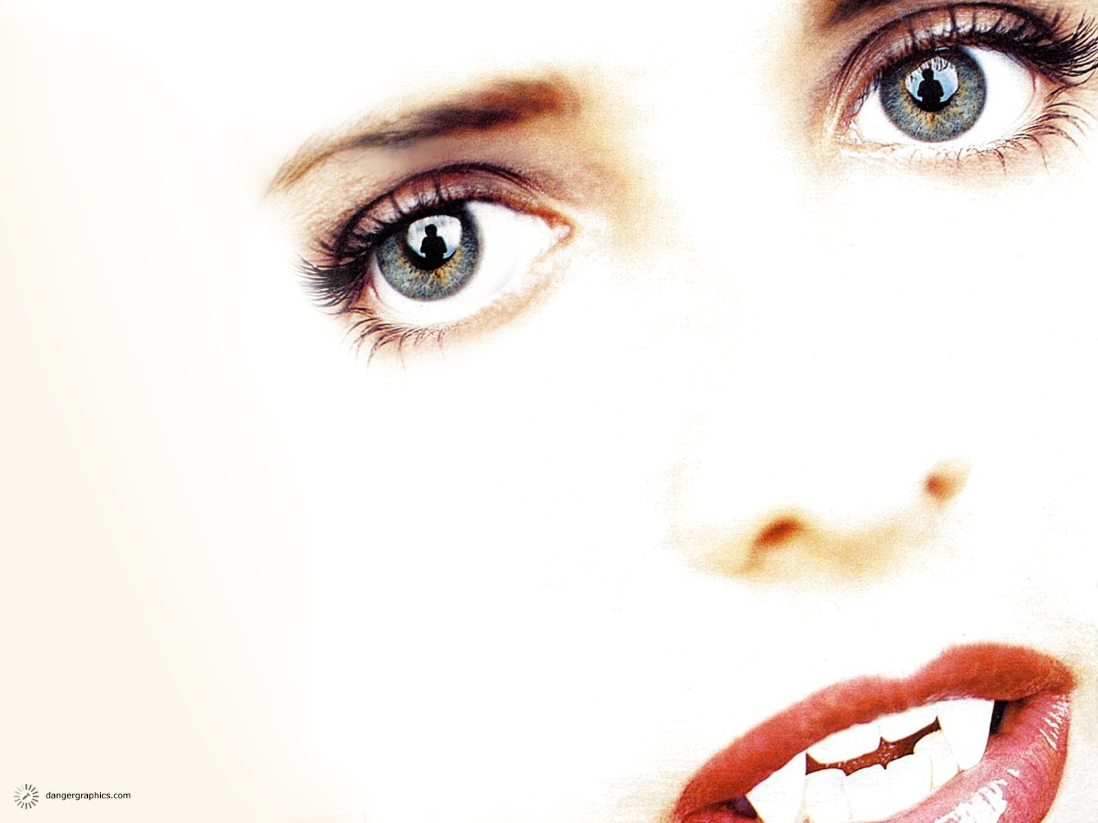 Close-up HD desktop wallpaper from the TV show Buffy the Vampire Slayer, highlighting an intense gaze and lips in a high-contrast, stylized composition.