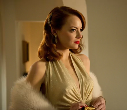 Emma Stone in a glamorous gold dress from the movie Gangster Squad, showcased in a 4K Ultra HD PC desktop wallpaper.