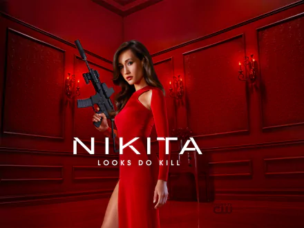 HD desktop wallpaper featuring Maggie Q from the TV show Nikita. She is in a red room, wearing a red dress, holding a gun with the text Nikita: Looks Do Kill.