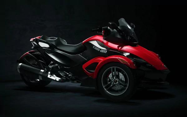 HD PC desktop wallpaper featuring a sleek red and black Can-Am three-wheeled vehicle against a dark background.