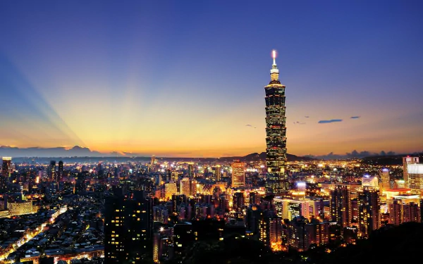 HD desktop wallpaper showcasing a vibrant Taipei cityscape at sunset with Taipei 101 prominently illuminated against a twilight sky.