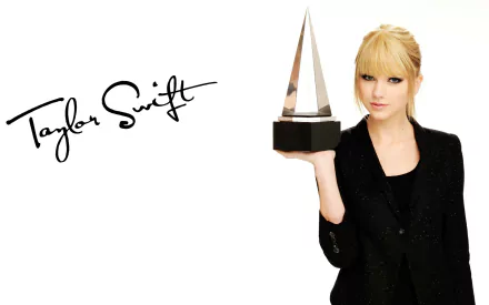 HD desktop wallpaper featuring actress and musician Taylor Swift holding an award, with her signature beside her.