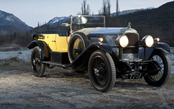 HD PC desktop wallpaper featuring a classic Vauxhall vintage vehicle set against a scenic mountainous backdrop at dusk.
