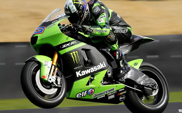 HD PC desktop wallpaper featuring a Kawasaki Ninja motorcycle in action on the track, showcasing its sleek green design and racing decals.