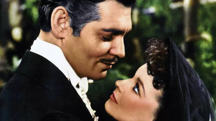 HD desktop wallpaper featuring a romantic close-up scene from the movie Gone With The Wind, showcasing the iconic characters in vintage attire.