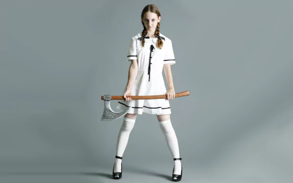 HD PC desktop wallpaper featuring a character from the movie Planet Terror, standing confidently with a large axe against a plain background.