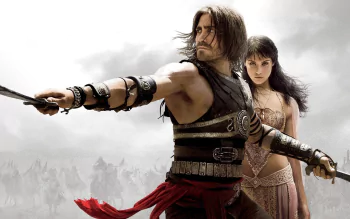 HD wallpaper featuring Jake Gyllenhaal as Prince Dastan and Gemma Arterton as Tamina from the movie Prince of Persia: The Sands of Time, with a dramatic desert backdrop.