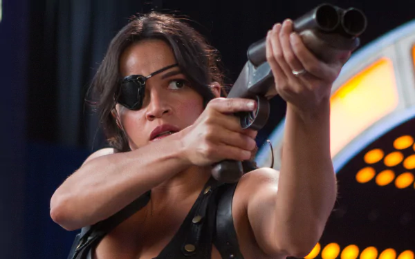 HD PC desktop wallpaper featuring Michelle Rodriguez as a fierce character from the movie Machete Kills, aiming a double-barreled shotgun.