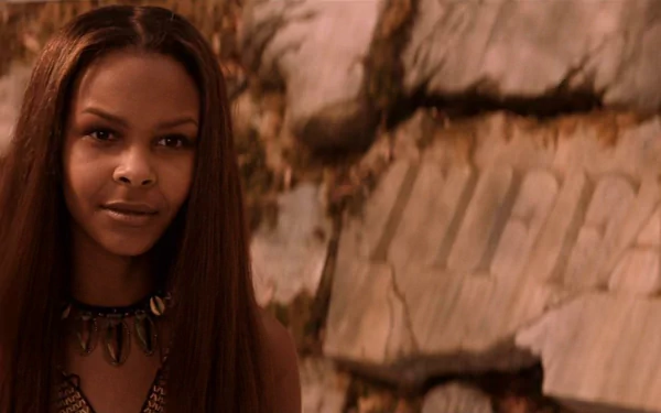 HD PC desktop wallpaper featuring Samantha Mumba from the 2002 movie The Time Machine, set against a rocky background.