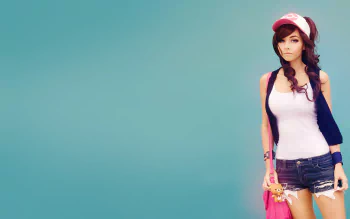 HD desktop wallpaper featuring a woman in cosplay with a white tank top, denim shorts, and a red and white cap against a solid teal background.
