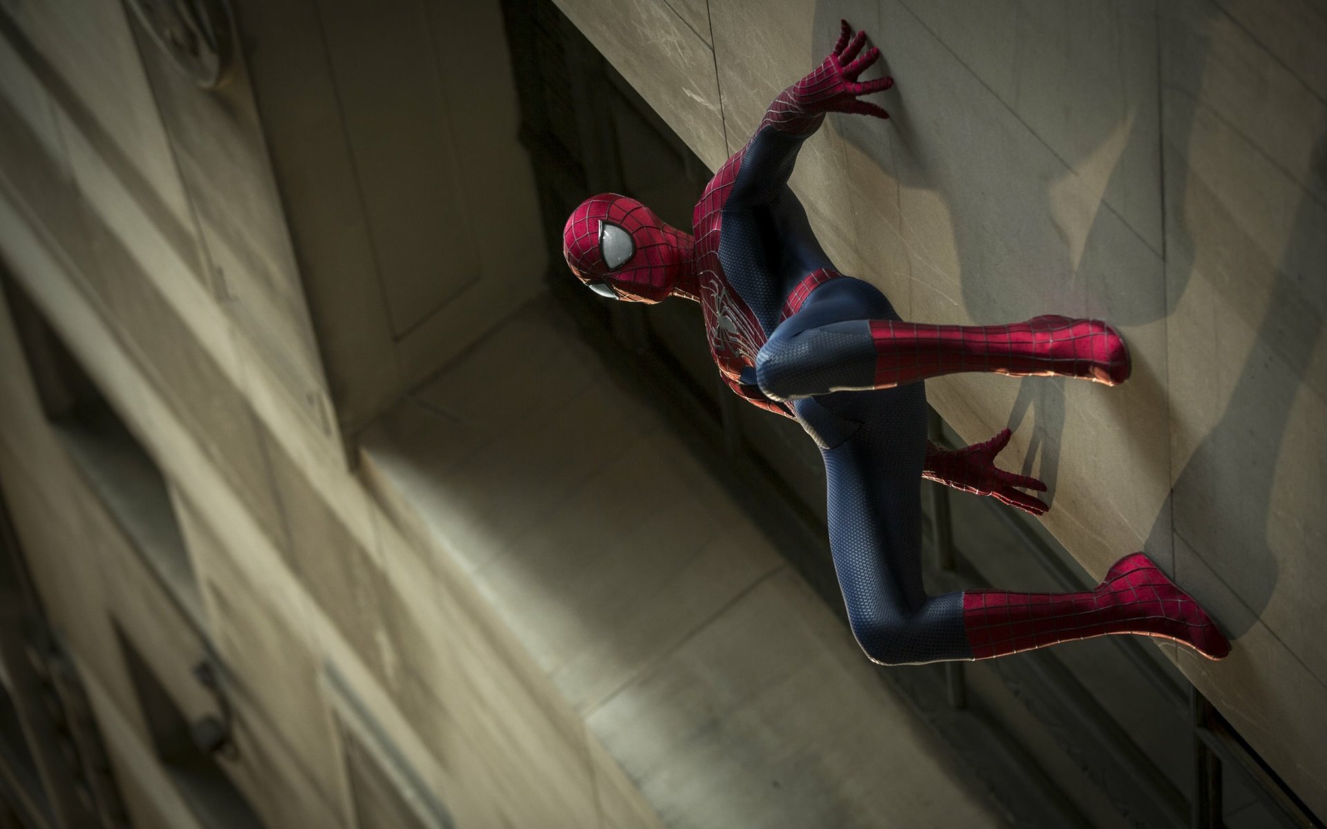 HD desktop wallpaper of Spider-Man in action from The Amazing Spider-Man 2, climbing a building.