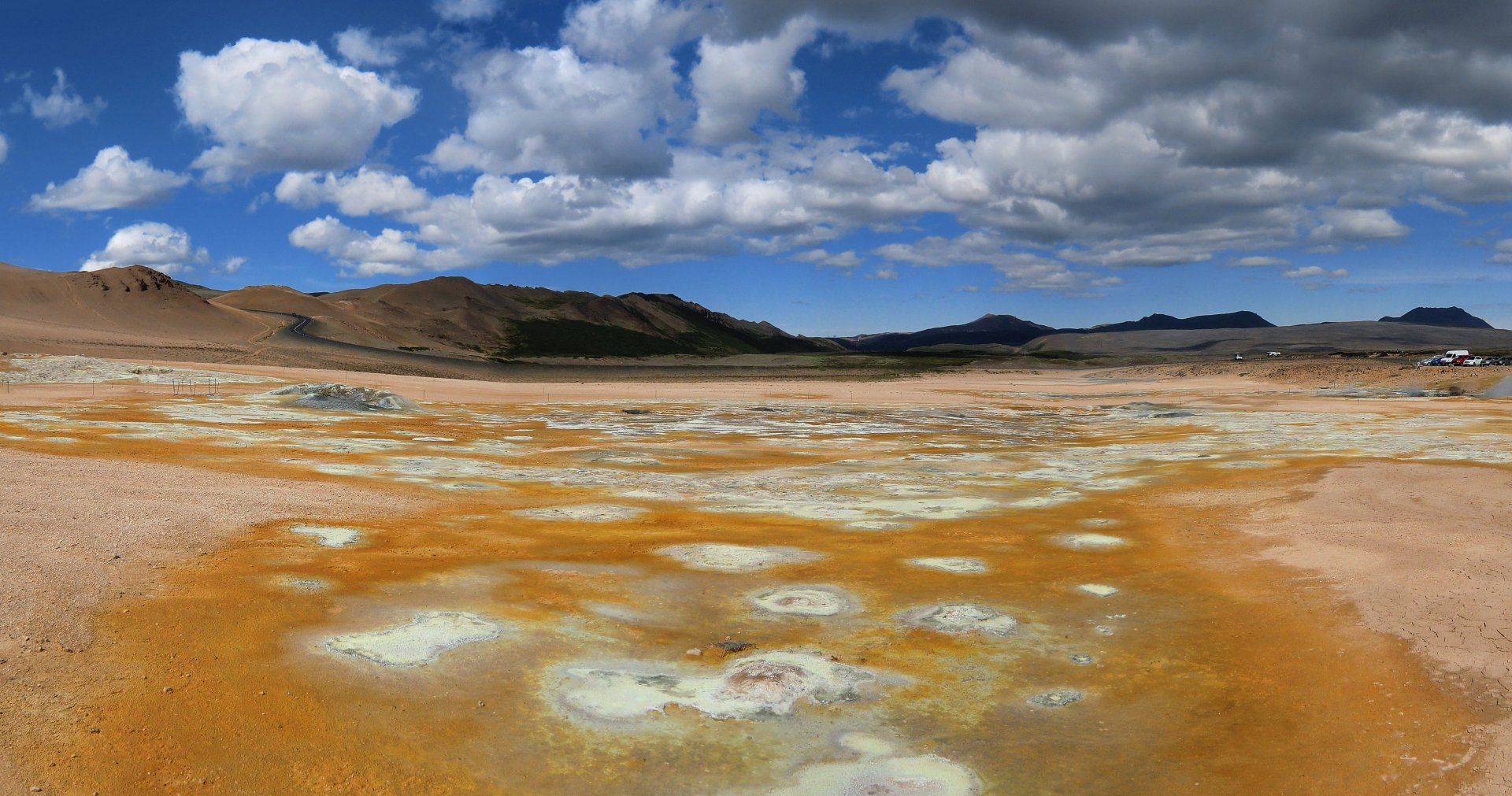 Sulfur field landscape in Iceland under a partly cloudy sky, captured in vibrant 4K Ultra HD resolution as a nature-themed PC desktop wallpaper.