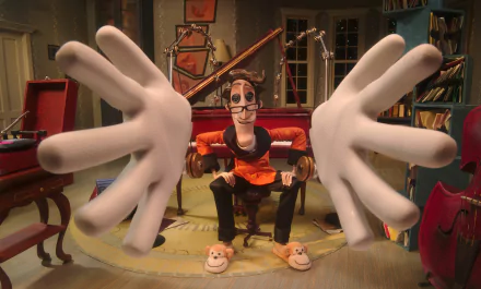 HD PC desktop wallpaper from the movie Coraline featuring a stop-motion character with oversized hands in a detailed room setting.