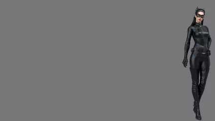 HD desktop wallpaper featuring Anne Hathaway as Catwoman (Selina Kyle) from The Dark Knight Rises movie against a plain gray background.