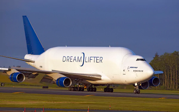 Boeing 747 Dreamlifter cargo airplane taxiing on runway — Boeing vehicle shown in 2K Quad HD PC desktop wallpaper background.