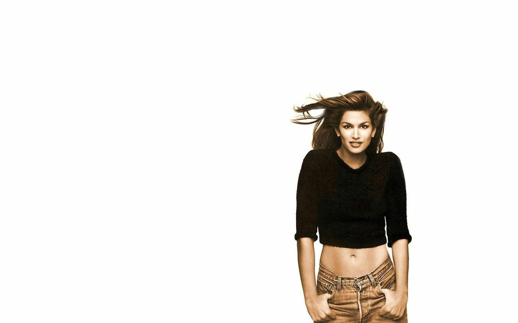 HD PC desktop wallpaper featuring celebrity Cindy Crawford standing confidently against a white background.