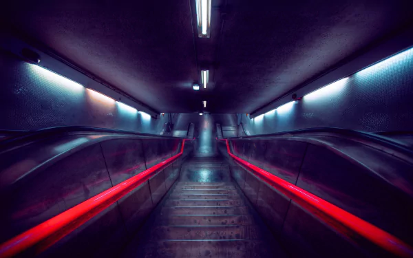 HD desktop wallpaper of a man-made subway escalator with glowing red handrails and cool blue lighting in an underground tunnel.