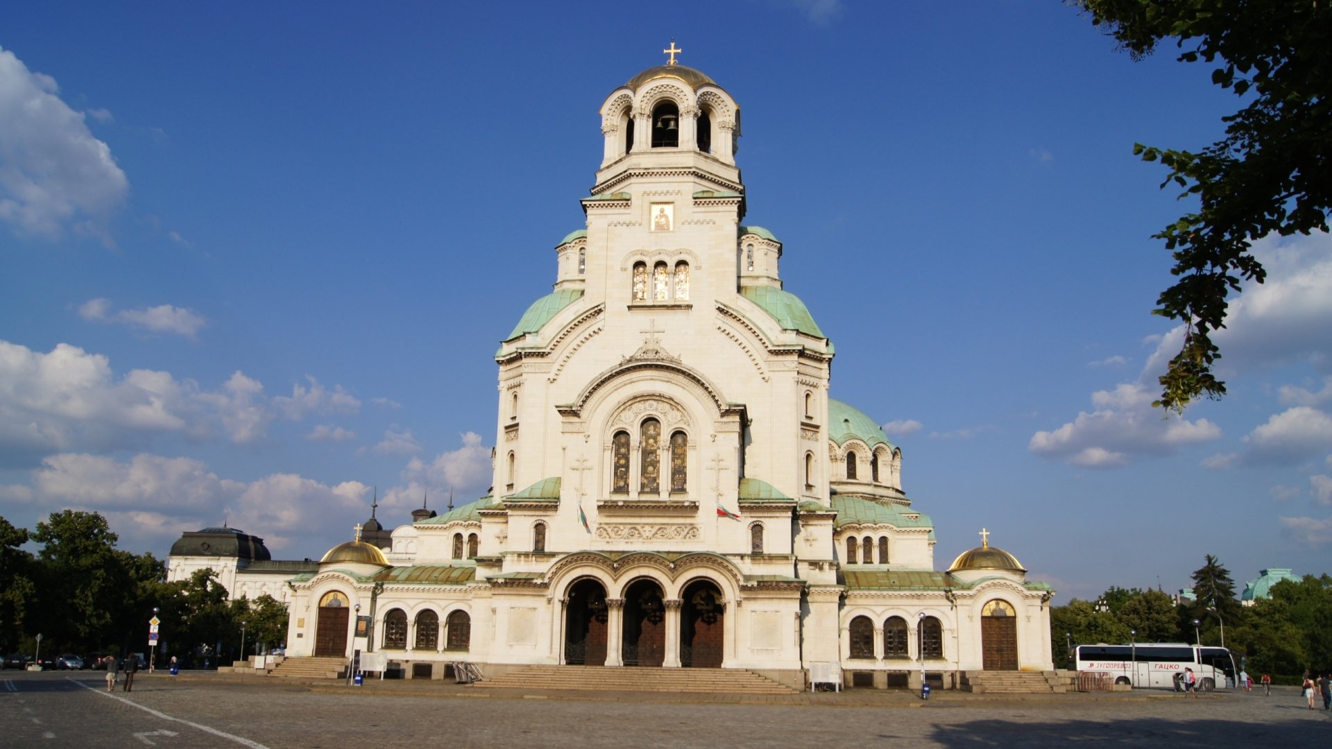 HD desktop wallpaper depicting the majestic Alexander Nevsky Cathedral in Sofia under a clear blue sky, showcasing its iconic religious architecture.