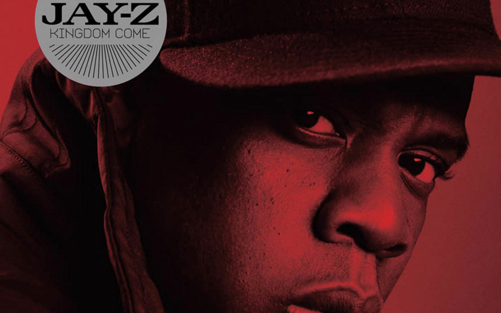 HD PC desktop wallpaper featuring a close-up portrait of Jay-Z with a red tint, highlighting the music artist and his Kingdom Come album theme.