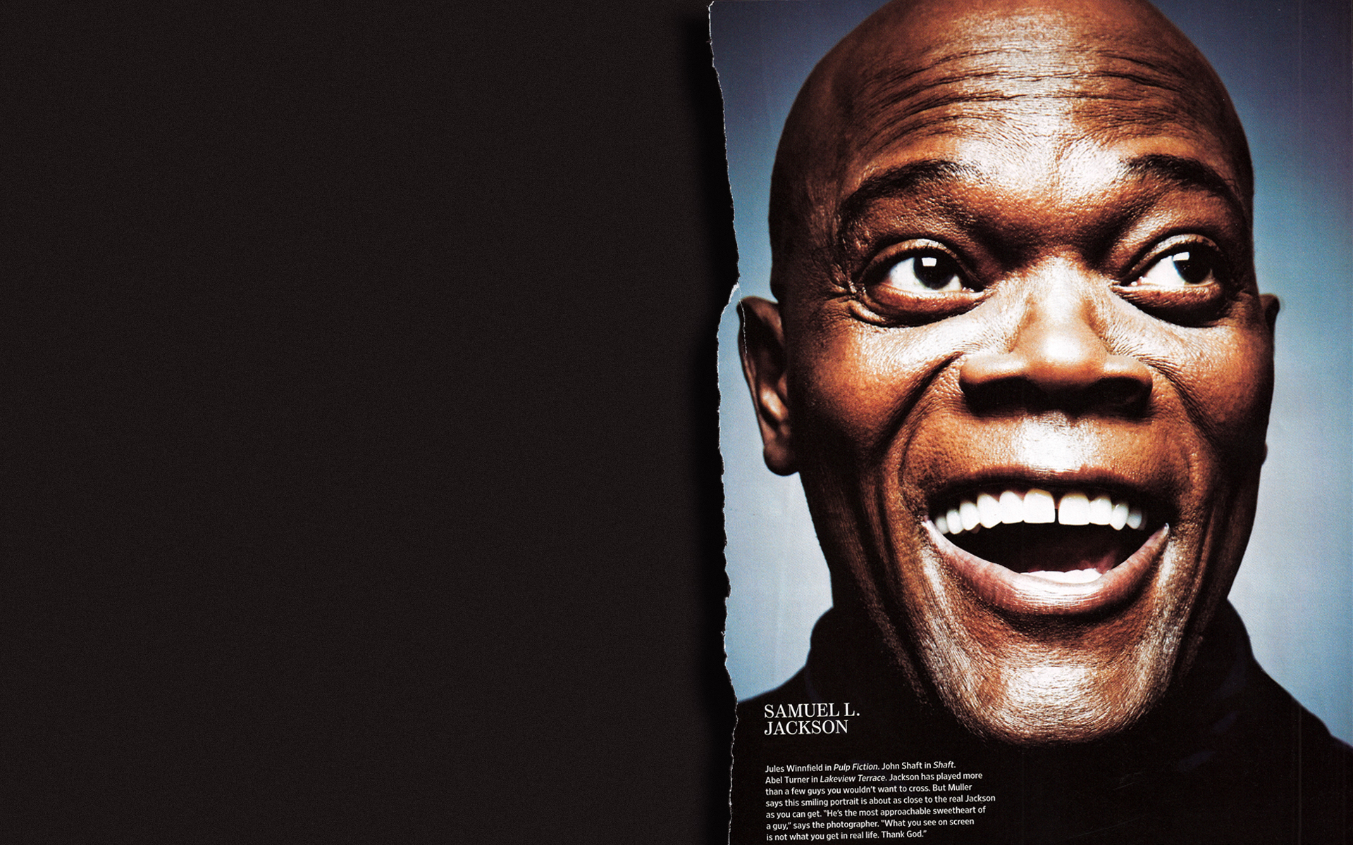HD desktop wallpaper featuring a close-up of a smiling Samuel L. Jackson against a dark background.