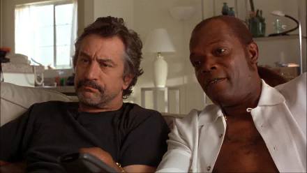 HD desktop wallpaper featuring a still from Jackie Brown with actors Samuel L. Jackson and Robert De Niro.