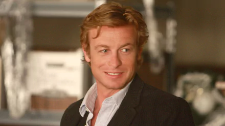 HD PC desktop wallpaper featuring Simon Baker as Patrick Jane from the TV show The Mentalist, showcasing a casual, confident look.