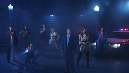 HD PC desktop wallpaper featuring the cast of the TV show Castle standing in a dimly lit urban setting with streetlights and a police car.