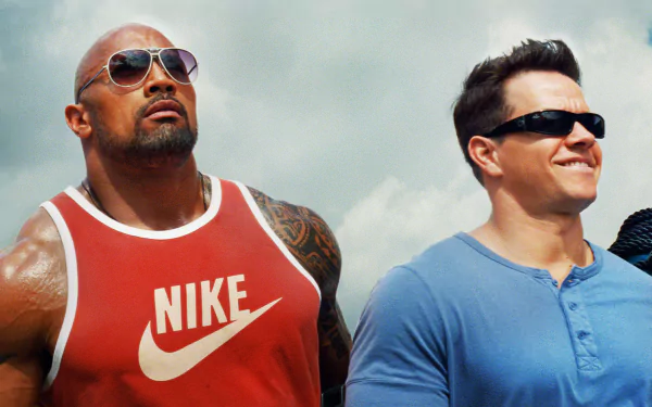 HD wallpaper featuring Dwayne Johnson and Mark Wahlberg as Paul Doyle and Daniel Lugo from the movie Pain & Gain, set against a bright, cloud-filled sky.
