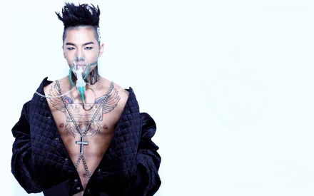 HD wallpaper featuring Taeyang from Bigbang, showcasing a striking image of him with intricate tattoos and wearing a stylish black jacket against a clean, white background.