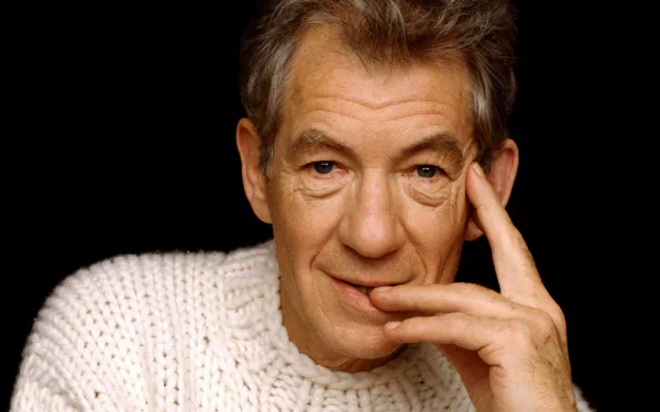 HD desktop wallpaper featuring a person posing with a thoughtful expression, suitable as a background.