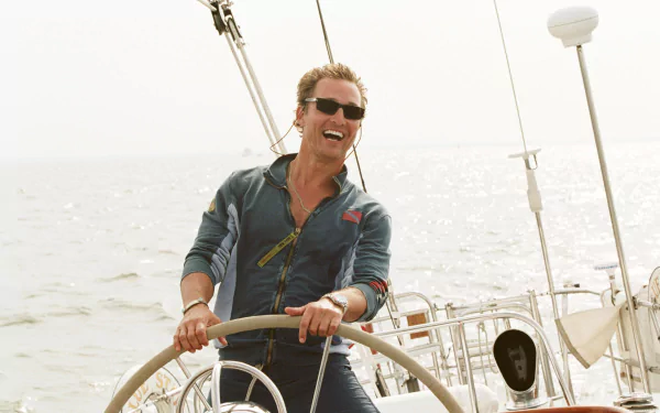 HD desktop wallpaper of American actor Matthew McConaughey smiling on a sailboat, a scene from the movie Failure to Launch.