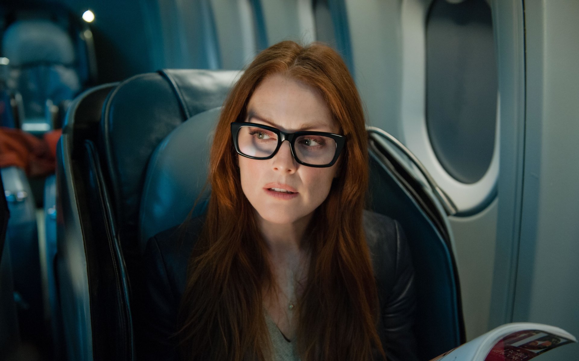 4K Ultra HD image of British actress Julianne Moore seated on a plane, featuring a scene from the movie Non-Stop.