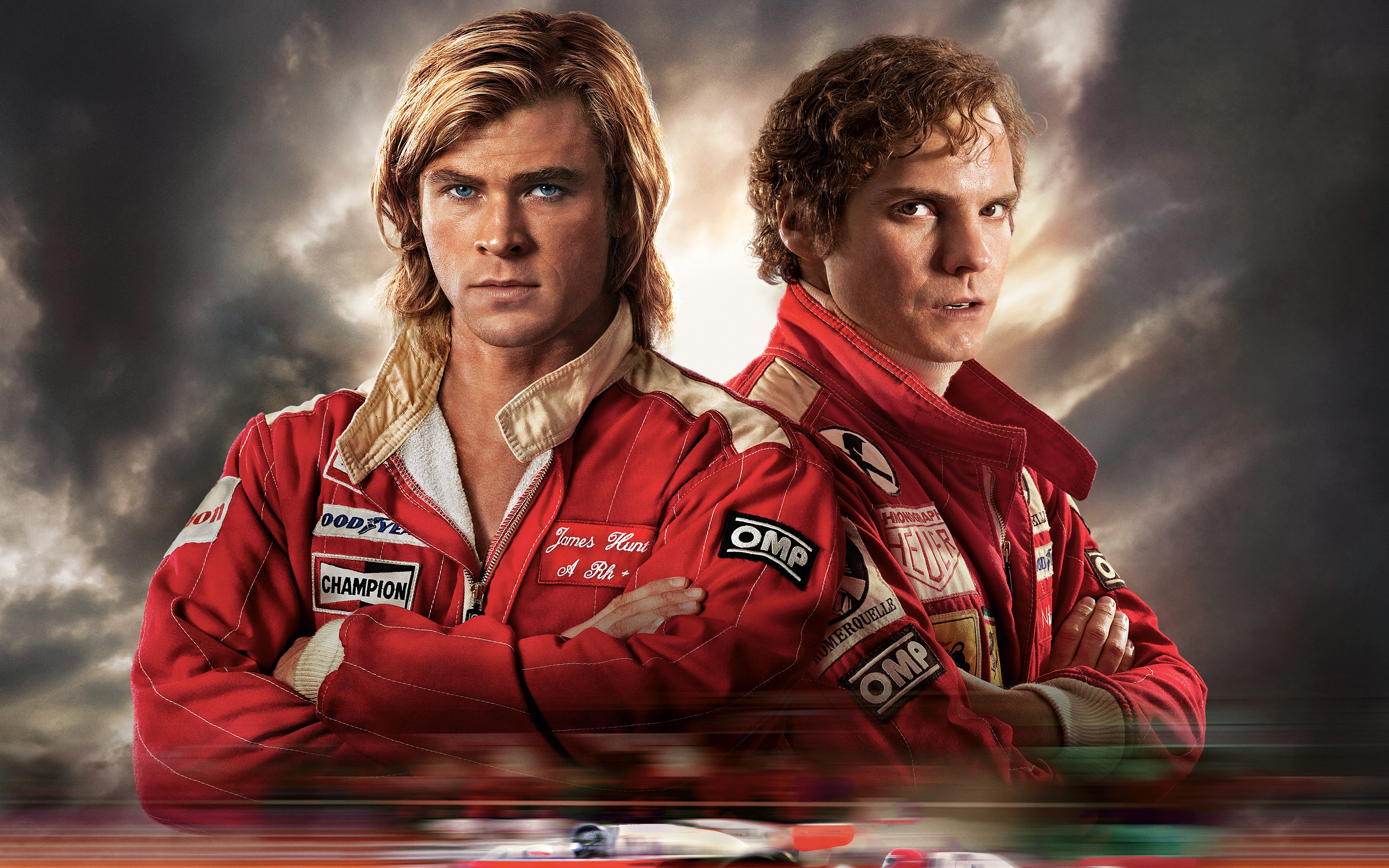 HD wallpaper featuring two racing drivers from the movie Rush (2013), set against a dramatic cloudy sky.