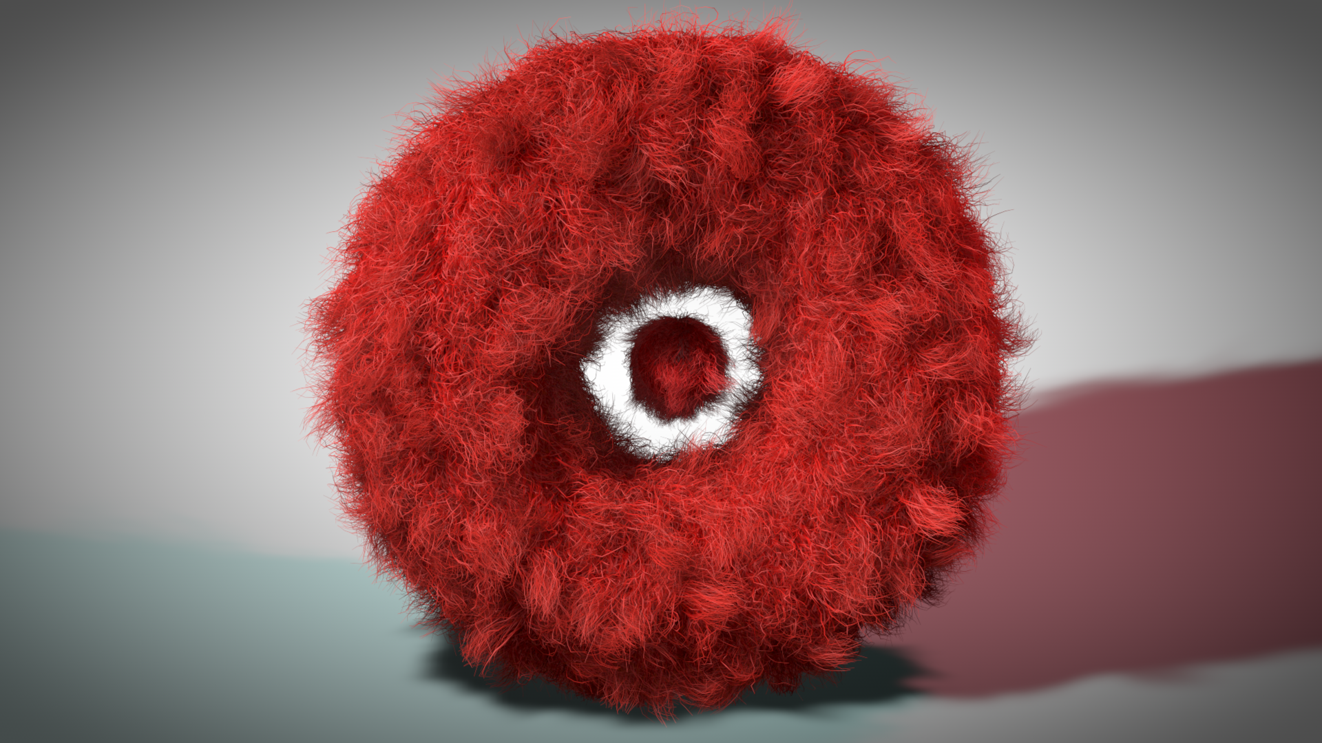 HD desktop wallpaper featuring a fluffy red donut-shaped object with a white center on a gradient background, created as digital art.