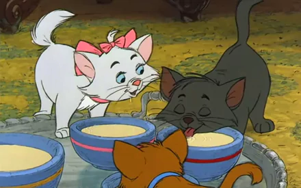 HD PC desktop wallpaper featuring characters from the movie The Aristocats, showing three animated cats around bowls of milk in a colorful outdoor setting.