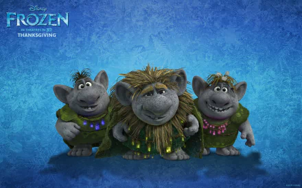 HD desktop wallpaper from Disney's Frozen featuring three trolls smiling against a blue textured background.