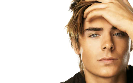 Close-up of Zac Efron, the American actor and celebrity, featuring his thoughtful expression against a clean background. A high-definition desktop wallpaper.