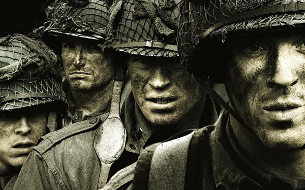 HD wallpaper featuring soldiers from the TV show Band of Brothers, with intense expressions and combat gear, ready for battle.