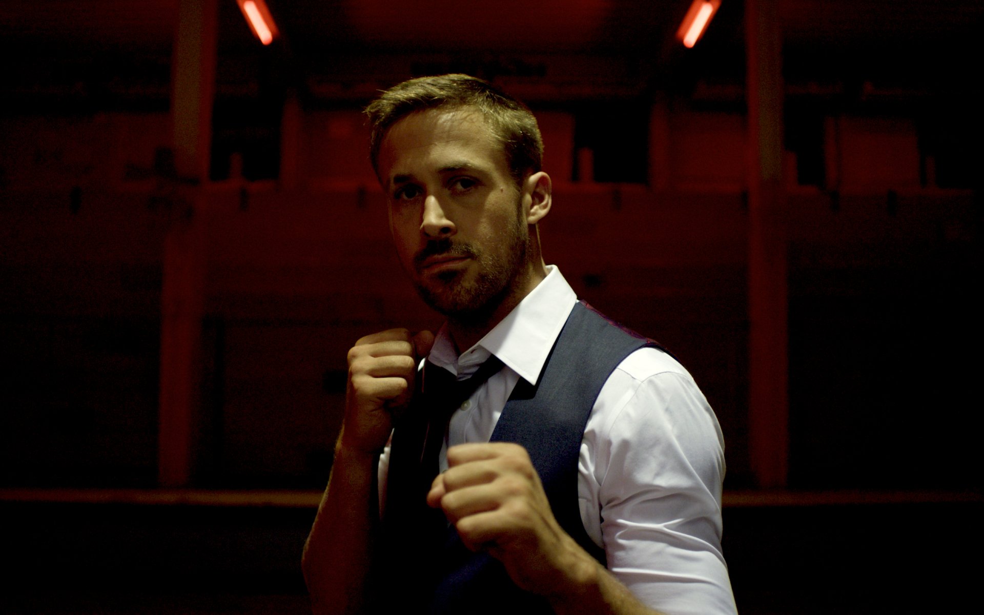 Ryan Gosling in a tense, dimly lit scene from the movie Only God Forgives, featured as an HD PC desktop wallpaper background.