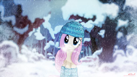 This HD My Little Pony: Friendship Is Magic wallpaper features Fluttershy in a snowy winter scene. She is dressed warmly in a blue hat and scarf, standing amidst a backdrop of snow-covered trees.