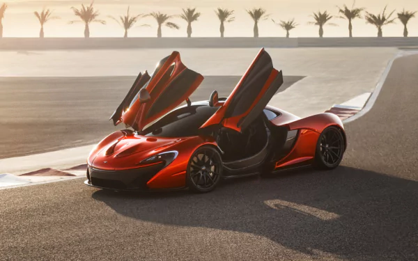 Red McLaren P1 vehicle with butterfly doors open on a sunlit racetrack — HD PC desktop wallpaper/background