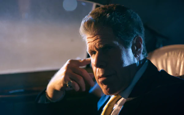 HD PC desktop wallpaper featuring Ron Perlman from the 2011 movie Drive, captured in a moody, low-lit car interior scene.